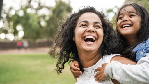 Mother and daughter playing in the park