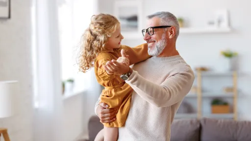 Man dancing with grandaughter