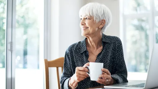 Cropped shot of a senior woman going through her finances while sitting at the dining room table