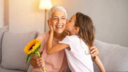 grandaughter kissing grandmother