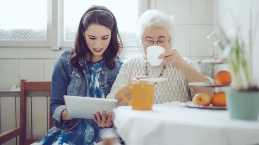 Social worker is visiting a senior woman