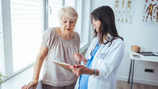 Elderly woman discussing treatment with her provider