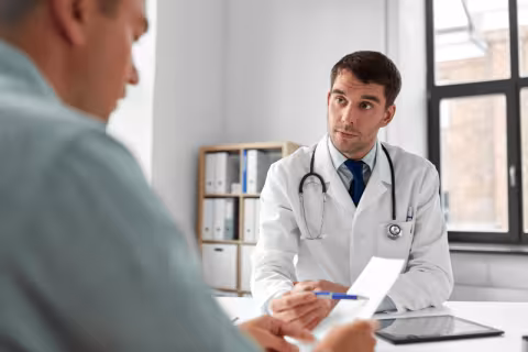 Doctor reviewing notes with a patient